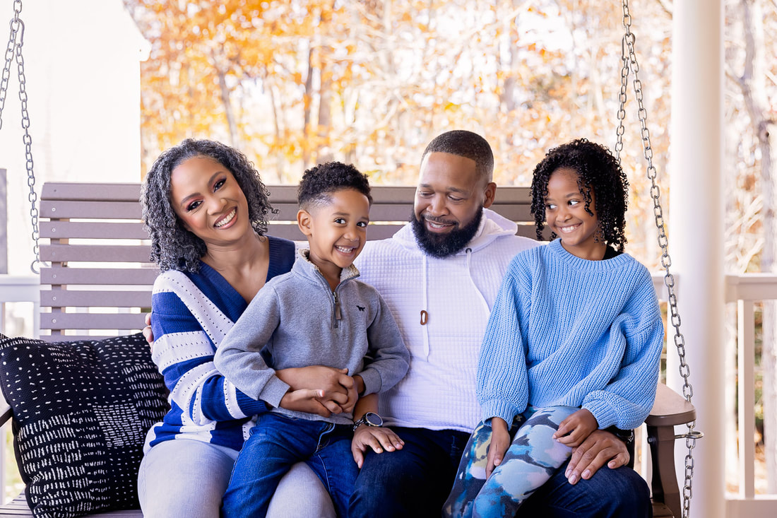 How adorable! This family of 4 decided to celebrate fall by taking family pictures on their front porch in Woodbridge, VA. Their happiness and excitement show in photos taken by Tamieka Smith a Northern Virginia Photographer. 
