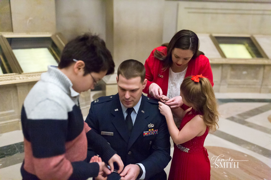 Pinning on Major Rank at Promotion Ceremony at The National Archives Museum