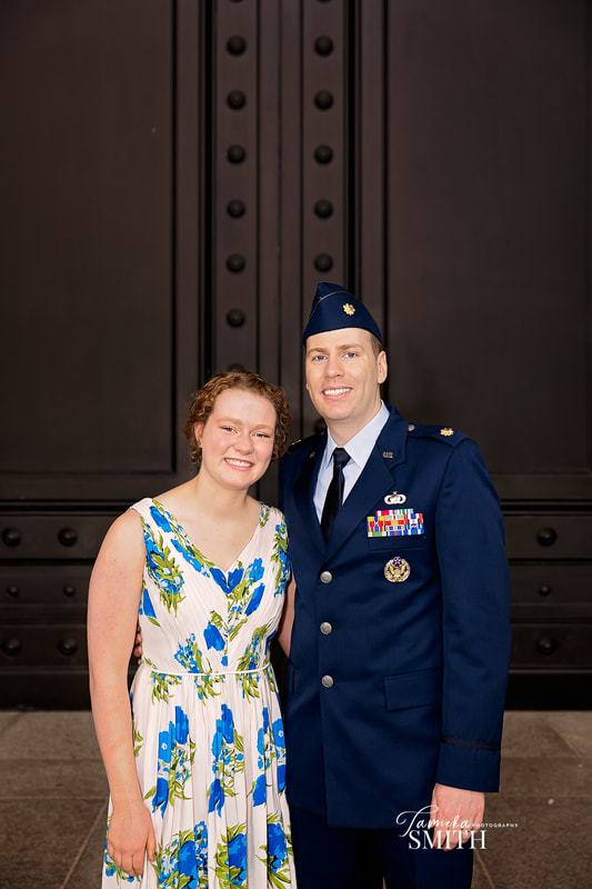 Air Force officer with his sister after a promotionj ceremony at The National Archives Museum