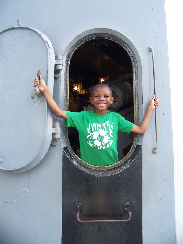 Los Angeles photographer captures Child standing outside the USS Alabama