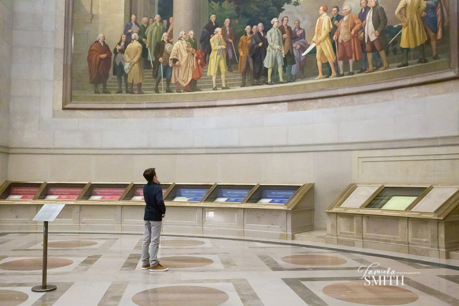 Boy standing in the Rotunda of the National Archives Museum