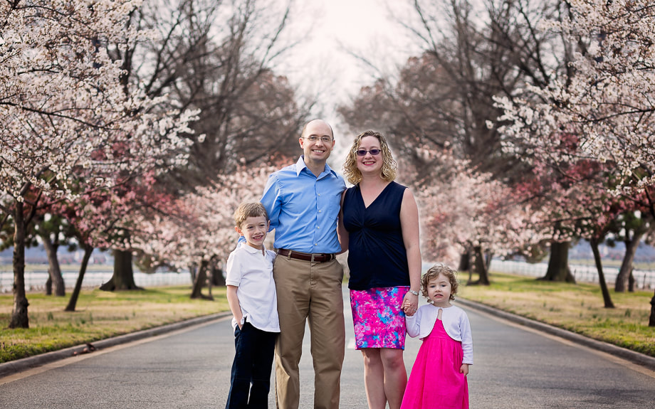 Family of four in the Cherry Blossoms in Washington DC; Northern Virginia Family Photographer Tamieka Smith