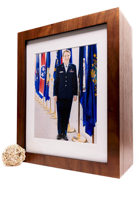 A beautiful 3XM Solutions Folio Box with Window opening, showcasing the exceptional work of Tamieka Smith Photography, a talented family photographer based in Northern Virginia. The folio box contains a stunning collection of photographs, captured during a photo shoot of an Air Force Officer promotion ceremony in Fairfax, VA. Tamieka expertly edited and arranged the images to showcase the Officer's professionalism, dedication, and character, captured perfectly through her lens. Each portrait is a work of art, expertly printed on high-quality paper and carefully arranged inside the folio box, which features a stylish window opening that allows a preview of the images within. This beautiful and elegant keepsake is a perfect representation of Tamieka's commitment to providing exceptional service and creating stunning works of art that capture the unique beauty and character of her clients.