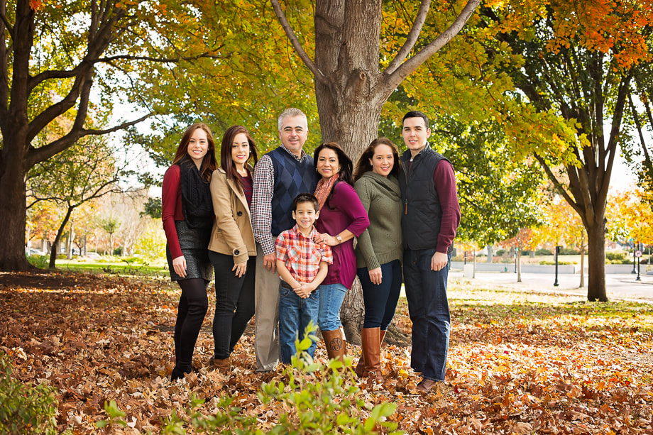 Family of seven posing in Washington DC for a family picture by Tamieka Smith; A Northern Virginia Photographer