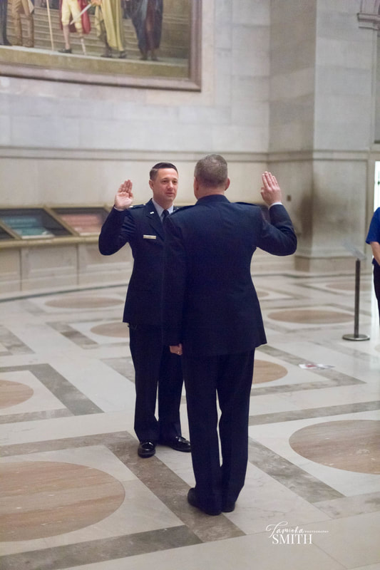 National Archives Photographer photographs an Air Force Promotion Ceremony