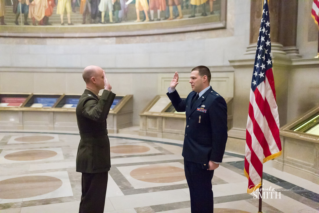 Air Force Officer administered the Oath of Office in front of the United States Constitution in the National Archives Museum