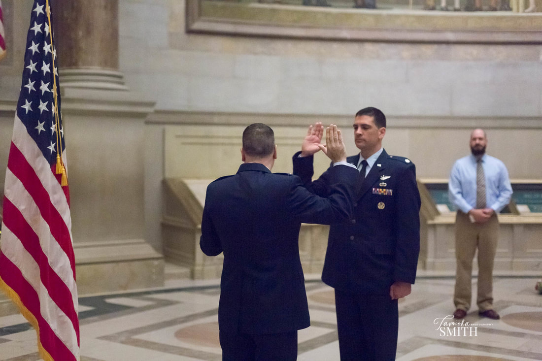 National Archives Photographer captures Air Force Officer being administered the Oath of Office