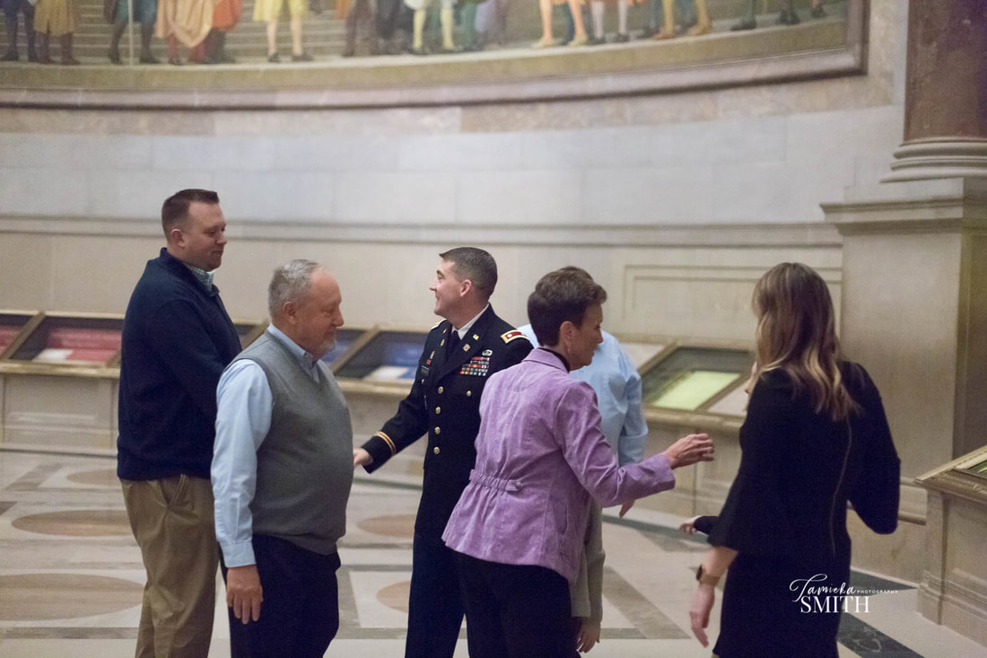 Guest congratulate Army Officer on his promotion at the National Archives