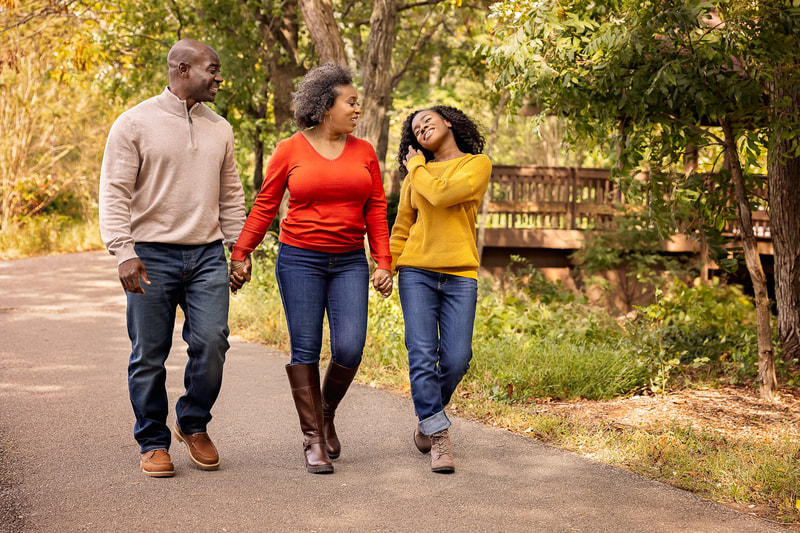 Look at this beautiful family of three, captured by the talented Northern Virginia Family Photographer, Tamieka Smith, as they take a leisurely stroll in the charming town of Occoquan, VA. The family radiates happiness and love, with each step they take capturing the precious moments of their time spent together. Tamieka has expertly captured the warm autumnal hues of the surroundings, perfectly complementing the family's natural and relaxed attire. These photographs are truly a testament to the beauty and joy that can be found in the simplicity of everyday life.